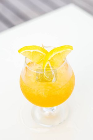 Photo for A vertical shot of a fresh cocktail on the white table - Royalty Free Image