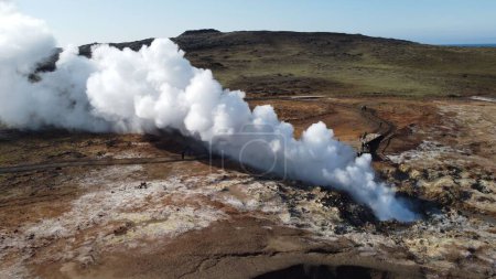 Photo for A drone shot of the white sulfur smoke coming out from Gunnuhver Hot Spring on a sunny day, Iceland - Royalty Free Image