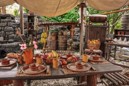 Téléchargez les photos : La table avec de la nourriture chez Robinson Crusoe Tree à Disneyland à Paris, France - en image libre de droit