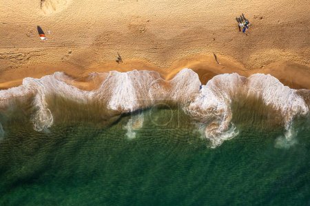 Photo for A drone top shot over sea water and sandy beach - Royalty Free Image
