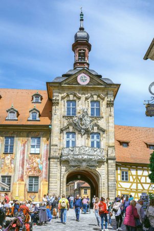 Photo for A vertical shot people rising the medieval Old Town Hall in Bamberg Germany on a sunny day - Royalty Free Image