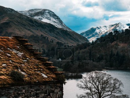 Photo for A landscape view of the Ullswater lake district in England with snow-covered mountains in the back - Royalty Free Image