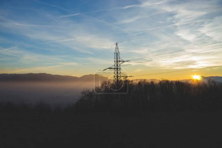 Photo for The communications tower with hills in the background at sunset - Royalty Free Image