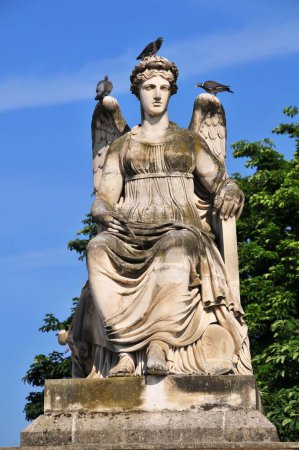 Photo for Three pigeons on angel sculpture in Jardin des Tuileries, Paris, France - Royalty Free Image