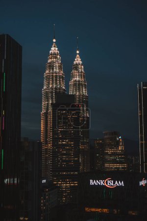 Photo for A landscape of Petronas Twin towers during sunset in city center, vertical shot - Royalty Free Image