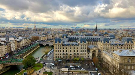 Photo for A drone view of the Paris cityscape with the Eiffel Tower and the Seine river surrounded by beautiful buildings - Royalty Free Image