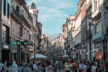 Photo for A beautiful crowded High street with old buildings in Porto, Portugal - Royalty Free Image