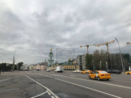 Photo for The road full of taxi cars with old buildings in the background on a cloudy day, Moscow, Russia - Royalty Free Image