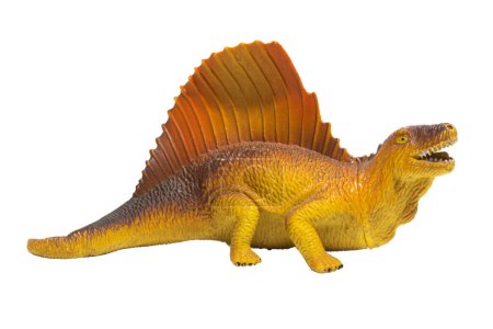 Foto de Un dinosaurio de juguete de perfil aislado sobre un fondo blanco. Dimetrodon amarillo y naranja. - Imagen libre de derechos