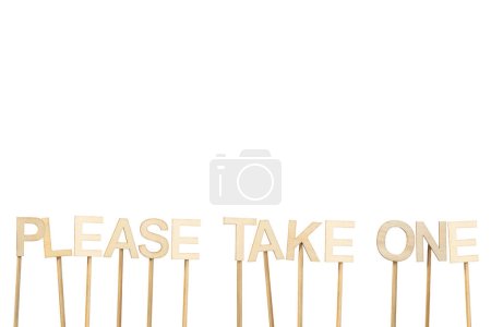 Sign made with wooden letters to give candy on Halloween. Text: Please take one. Image with isolated background and copy space.
