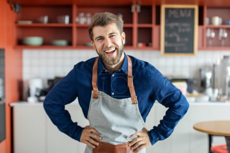 Photo for Portrait of excited handsome european male barista standing at coffee cafe counter and smiling at camera, coffee shop owner - Royalty Free Image