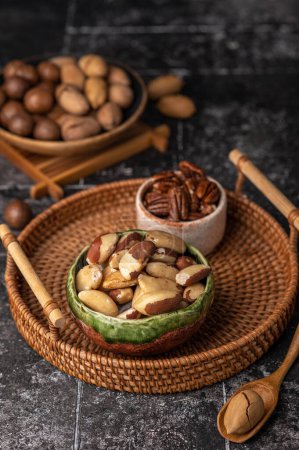 Photo for Various Nuts in wooden bowl on dark background. - Royalty Free Image