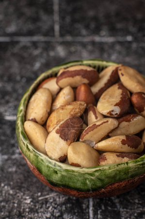 Photo for Tasty brasil nuts on black background - Royalty Free Image