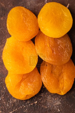 Photo for Tasty dried apricots as background - Royalty Free Image