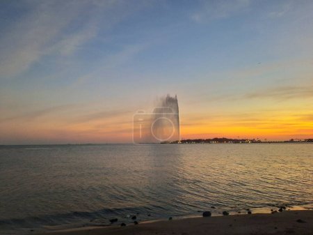 Beautiful sunset at Jeddah, Corniche. The Jeddah Corniche, also known as the Jeddah Waterfront, is a coastal area of the city of Jeddah, Saudi Arabia. Located along the Red Sea.