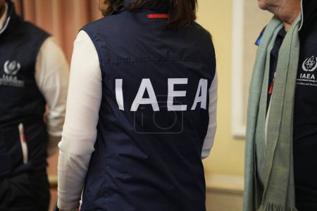 Photo for KYIV, UKRAINE - FEBRUARY 6, 2024: A woman can be seen with 'IAEA' written on her back during the met with Ukrainian Minister of Energy German Galushchenko on February 6, 2024 in Kyiv, Ukraine - Royalty Free Image