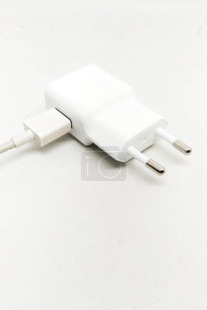 Photo for Adapter head for charging a smartphone on a white background - Royalty Free Image