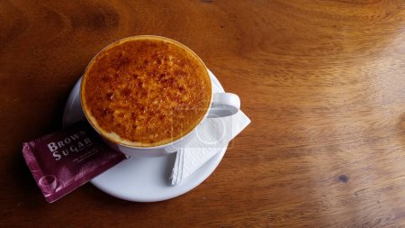a glass of coffee with caramelized sugar