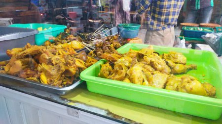 a choice of chicken cuts sold by fried chicken sellers, ready to be cooked to order. There are also chicken offal satay, chicken skin satay, tofu and tempeh