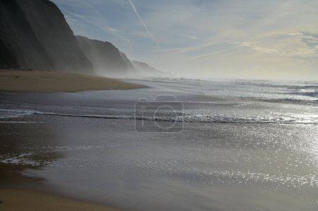 Photo for Magoito Beach on Atlantic ocean at sunset, beautiful sandy beach on Sintra coast, Lisbon district, Portugal, part of Sintra-Cascais Natural Park with natural points of interest - Royalty Free Image