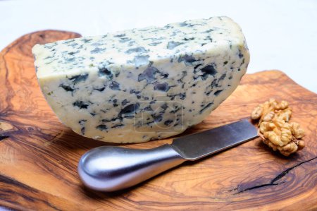Photo for Cheese collection, piece of French blue cheese auvergne or fourme d'ambert close up - Royalty Free Image