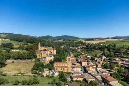 Wine making region Beaujolais Pierre dorees wioth yellow houses and hilly vineyards, aerial view, France in summer