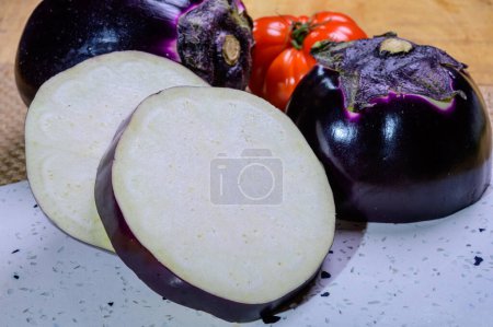 Photo for Fresh ripe purple globe Violetta eggplants vegetables from Florence ready to cook, healthy Italian food - Royalty Free Image