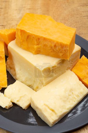 Photo for British cheeses collection, Scottish coloured and English matured cheddar cheeses close up - Royalty Free Image
