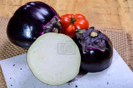 Photo for Fresh ripe purple globe Violetta eggplants vegetables from Florence ready to cook, healthy Italian food - Royalty Free Image
