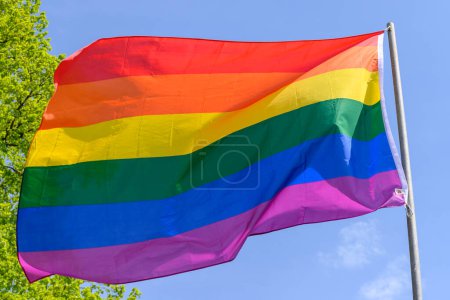 Photo for Gay pride rainbow colours flag and blue sky outdoor - Royalty Free Image