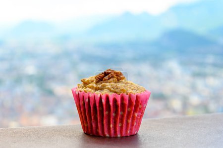 Photo for Gateau Grenoblois, French Walnut Coffee Cake, specialty from Grenoble and view on central part of Grenoble city from Bastille fortres witn mountains around, old cable cars, Isere, France - Royalty Free Image