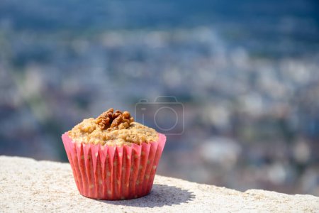 Photo for Gateau Grenoblois, French Walnut Coffee Cake, specialty from Grenoble and view on central part of Grenoble city from Bastille fortres witn mountains and old cable cars , Isere, France - Royalty Free Image
