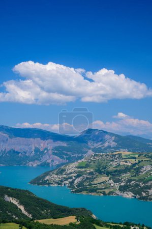 Photo for Aerial view on blue lake of Serre-Poncon, reservoir border between Hautes-Alpes and Alpes-de-Haute Provence   departments, one of largest in Western Europe - Royalty Free Image