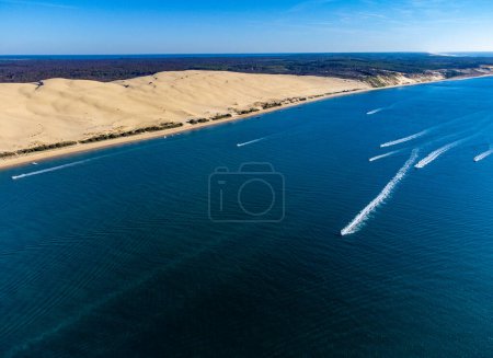 Aerial view of Dune of Pilat tallest sand dune in Europe located in La Teste-de-Buch in Arcachon Bay area, France southwest of Bordeaux along France's Atlantic coastline in sunny day