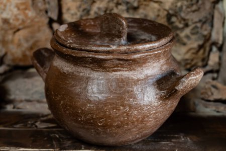 Old terracotta clay kitchenware jars, jugs and pots, ancient cookware
