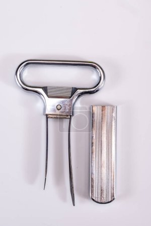 Corkscrew for opening of old bottles of wine, twin-prong cork puller can extract stopper without damage, on white background isolated