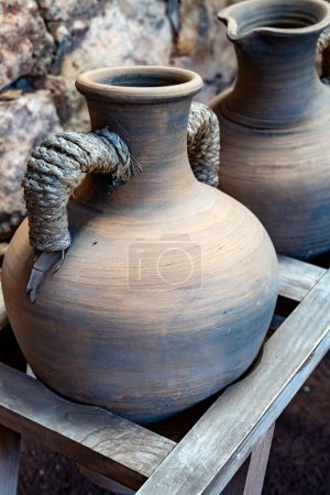 Old terracotta clay kitchenware jars, jugs and pots, ancient cookware