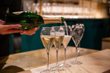 Pouring and tasting of dry sparkling wine champagne on winter weekend festival in December on Avenue de Champagne, Epernay, Champagne region, France