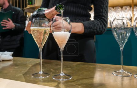 Pouring and tasting of sparkling wine champagne on winter weekend festival in December on Avenue de Champagne, Epernay, Champagne region, France