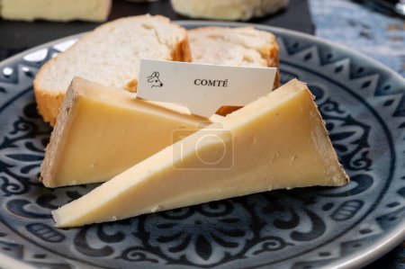 French cheese Comte, three varieties 1 year matured Prestige, fruity flavoured Fruite and Vieille Reserve close up