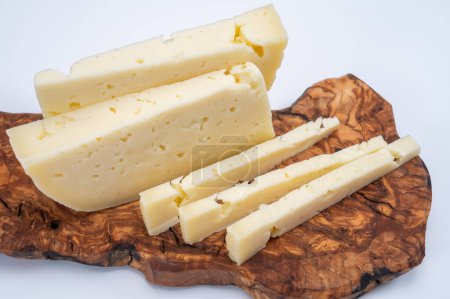 Fresh Asiago cow's milk cheese, produced in Asiago in Italy, different textures according to its aging, used in panini, sandwiches, melted on variety of dishes, classified Swiss-type Alpine cheese