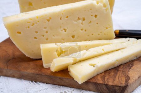 Fresh Asiago cow's milk cheese, produced in Asiago in Italy, different textures according to its aging, used in panini, sandwiches, melted on variety of dishes, classified Swiss-type Alpine cheese