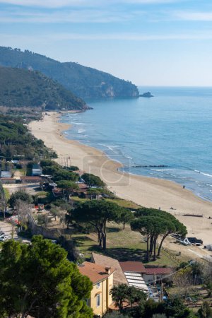 View on sandy beach from hilly medieval small touristic coastal town Sperlonga and sea shore, Latina, Italy in winter