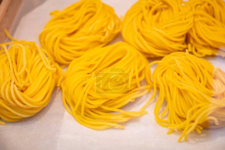 Italian food, fresh homemade yellow pasta with eggs ready to cook on display, Milan, Lombardy, Italy