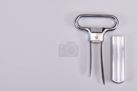Corkscrew for opening of old bottles of wine, twin-prong cork puller can extract stopper without damage, on white background isolated
