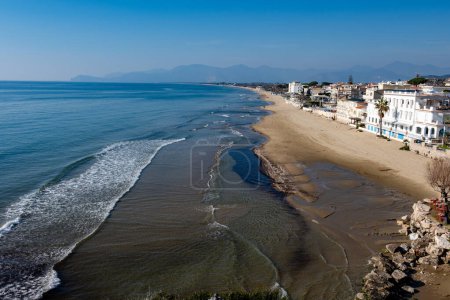 View on sandy beach from hilly medieval small touristic coastal town Sperlonga and sea shore, Latina, Italy in winter