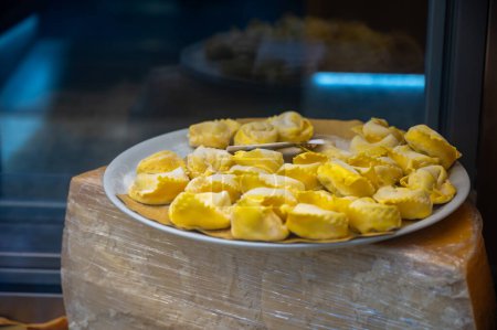 Italian food, fresh homemade stuffed pasta tortelli or ravioli dumplings ready to cook on display, Milan, Lombardy, Italy