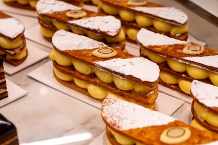 Portion of french mille-feuille cake, vanilla or custard slice, Napoleon puff pastry layered with pastry cream in bakery