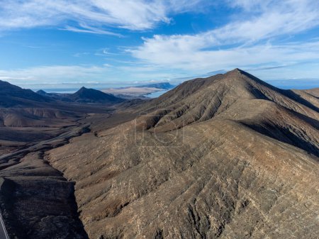 Panoramic view on colourful remote basal hills and mountains of Massif of Betancuria as seen from observation point, Fuerteventura, Canary islands, Spain, travel destination
