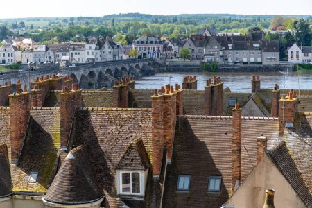 Views of tiled roofs and chimneys of houses in old part of town of Gien is on the Loire river, in Loiret department, France